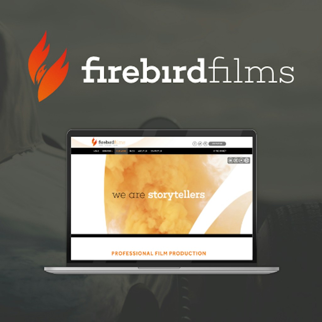A laptop with firebirdfilms' homepage with the firebirdfilms title above it.